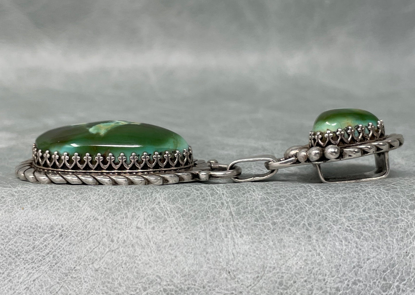 3 inch Sterling Silver pendant set with two stunning Royston Turquoise stones by Anglo artisan John Hartman of Durango Silver Company - left side view