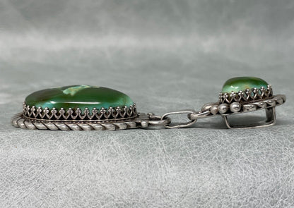 3 inch Sterling Silver pendant set with two stunning Royston Turquoise stones by Anglo artisan John Hartman of Durango Silver Company - left side view